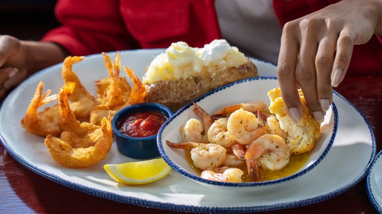 Dipping biscuit into Endless Shrimp